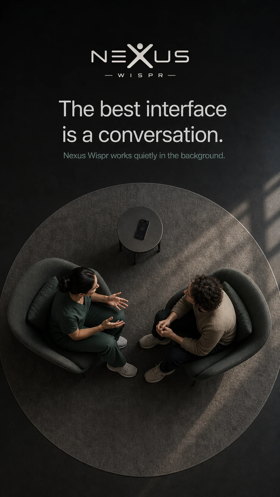 An overhead view of a clinician and patient in conversation, with a recording phone on the small table.