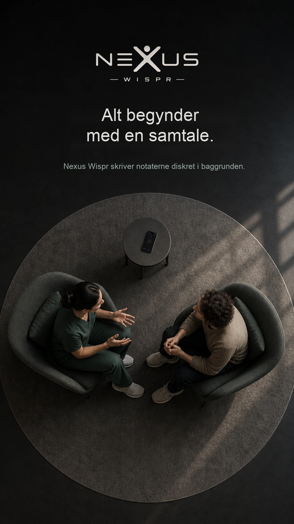 En konsultation set ovenfra, med en telefon, der optager på det lille bord.